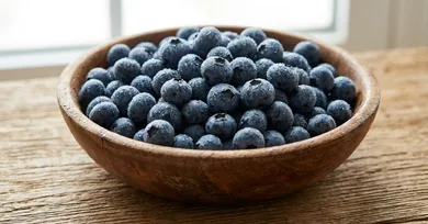 Fresh ripe blueberries in a bowl close up